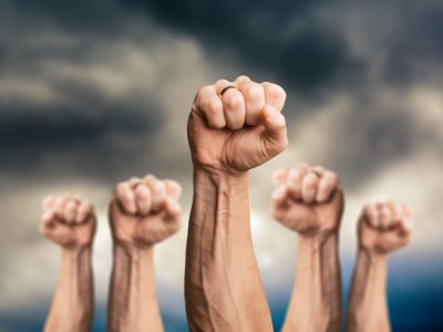 Peoples,Raised,Fist,Air,Fighting,And,Sunlight,Effect,,Competition,,Teamwork