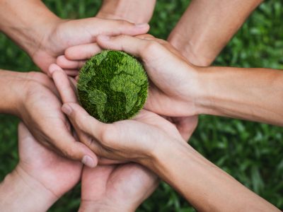 Earth Day. Hands adult Teamwork harmony Holding earth on hands. Environmental and reduce global warming help earth, top view. ecology and environment sustainable concept.